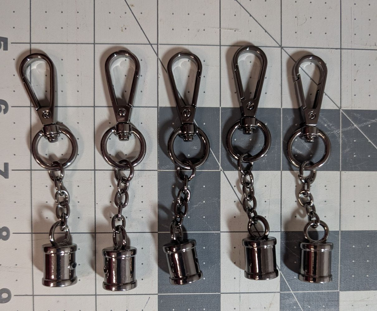 Gunmetal Tassel Caps